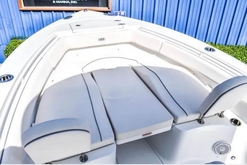 Slide: The Image of 2025 Sea Hunt Ultra 255 SE boat interior with cushioned seating. - 16