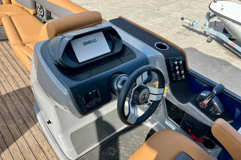Slide: The Image of 2026 Harris Sunliner 250 boat dashboard with Simrad display. - 14