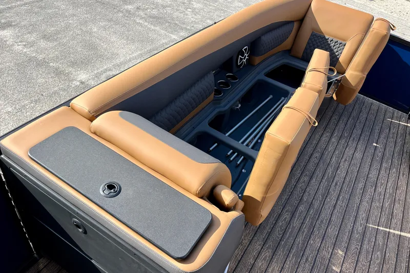Slide: The Image of Interior of Harris Sunliner 250 boat, 2026 model, featuring luxurious seating. - 31