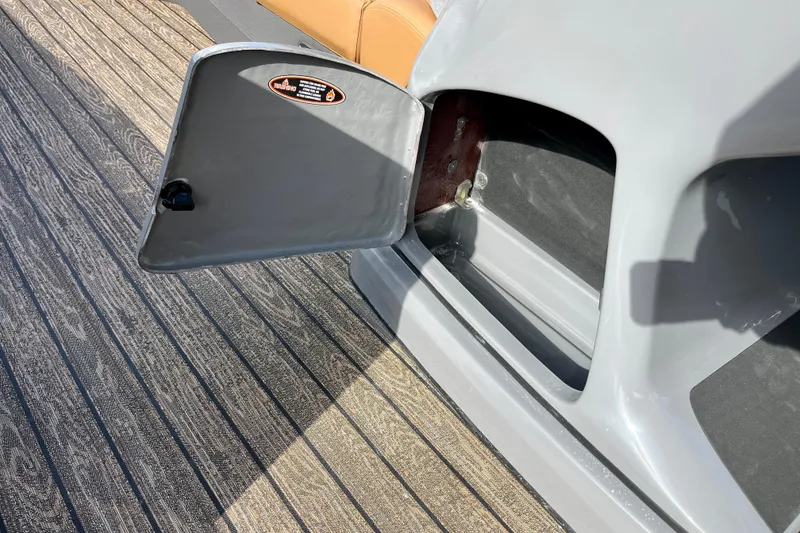 Slide: The Image of Open storage compartment on Harris Sunliner 250 boat, model 2026. - 38