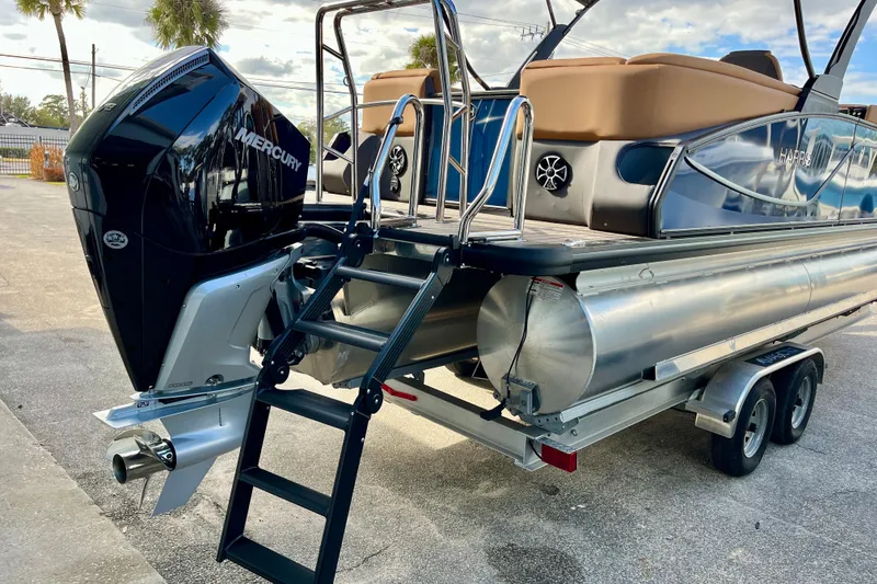 Slide: The Image of 2026 Harris Sunliner 250 with Mercury engine and ladder on trailer. - 41