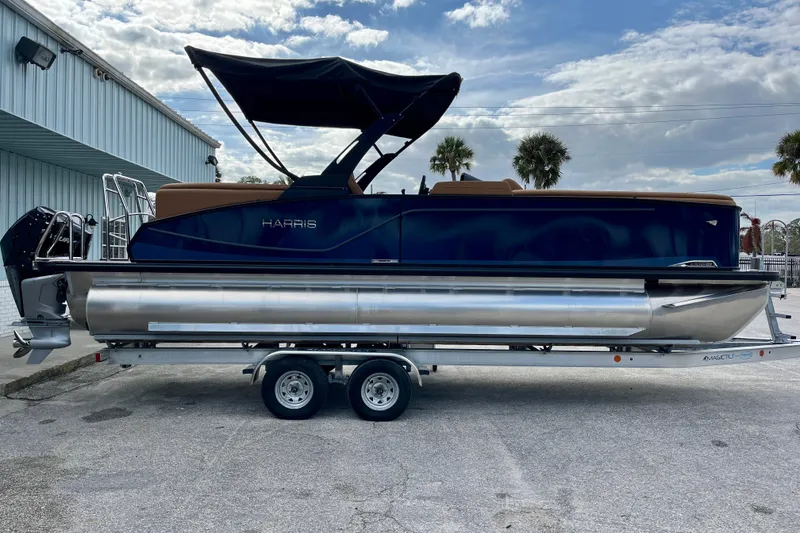 Slide: The Image of 2026 Harris Sunliner 250 pontoon boat on trailer, side view. - 8