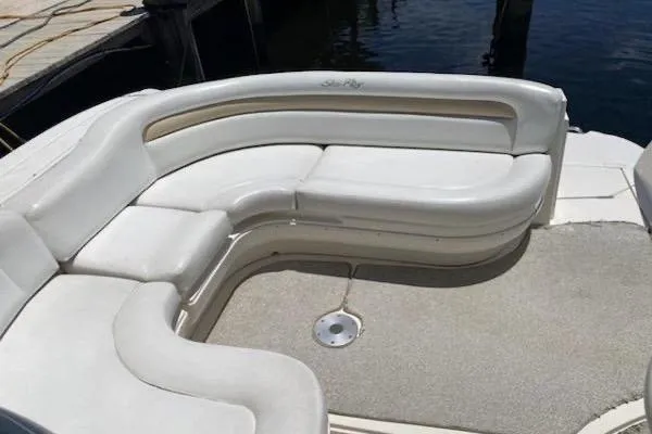 Slide: The Image of 2008 Sea Ray 340 Sundancer boat with white cushioned seating area. - 12