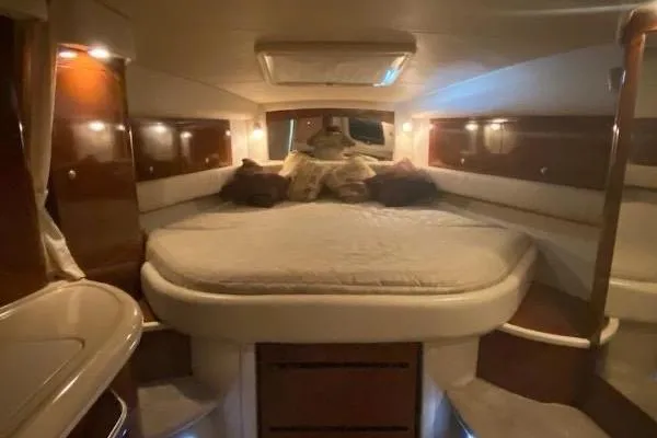 Slide: The Image of Interior cabin of 2008 Sea Ray 340 Sundancer yacht, featuring a cozy bed. - 3