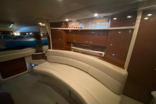 Slide: The Image of Interior of 2008 Sea Ray 340 Sundancer yacht with elegant seating and wood finishes. - 4