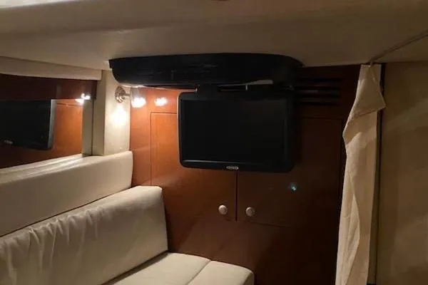 Slide: The Image of Interior of 2008 Sea Ray 340 Sundancer with TV, cozy seating, and ambient lighting. - 5
