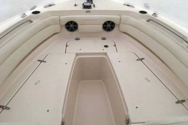 Slide: The Image of 2019 Grady-White Freedom 235 boat interior with spacious seating and storage compartments. - 22