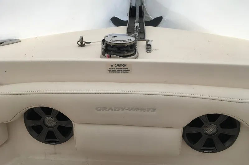 Slide: The Image of 2019 Grady-White Freedom 235 boat interior with Fusion speakers and anchor winch. - 24