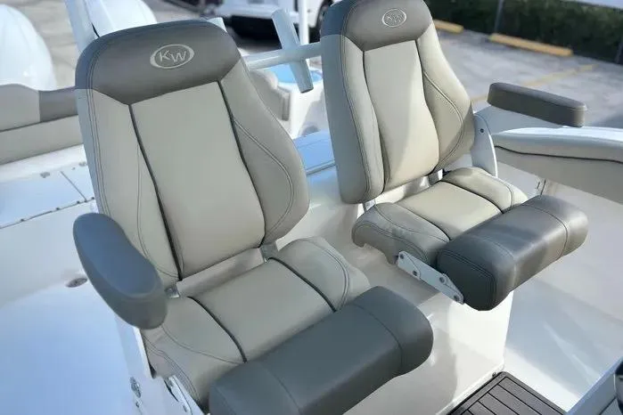 Slide: The Image of 2023 Key West 263 FS boat seats, featuring gray and beige cushioned design. - 20