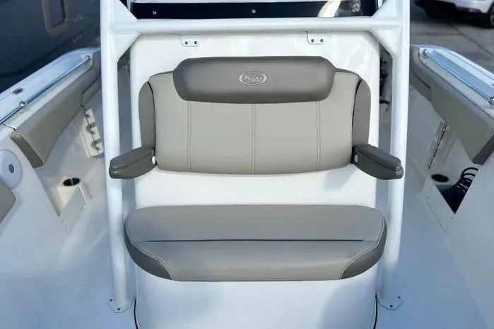 Slide: The Image of 2023 Key West 263 FS boat seat with gray upholstery and armrests. - 27