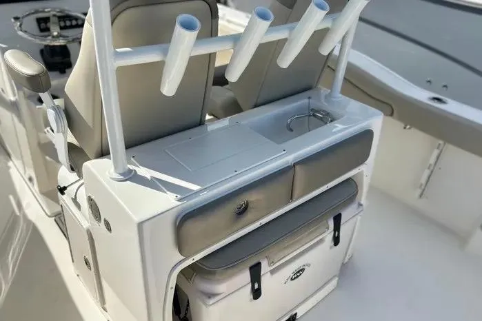 Slide: The Image of 2023 Key West 263 FS boat interior with rod holders and storage compartments. - 28