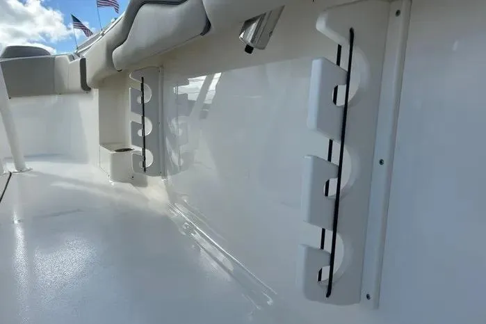 Slide: The Image of 2023 Key West 263 FS boat interior with rod holders and seating. - 35