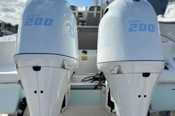 Slide: The Image of Twin Yamaha 200 engines on a 2023 Key West 263 FS boat. - 4