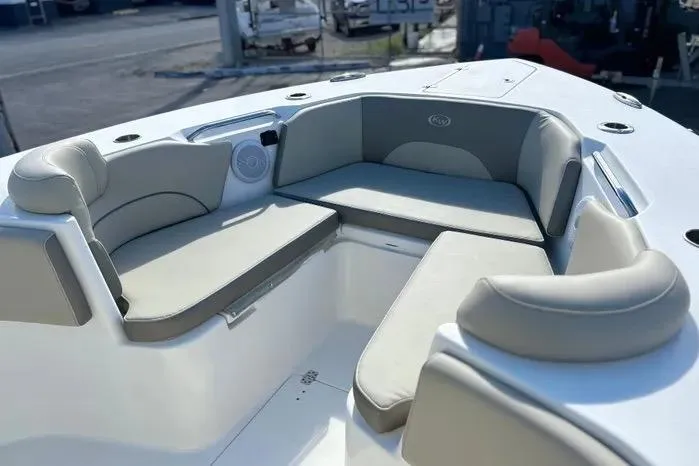 Slide: The Image of 2023 Key West 263 FS boat interior with cushioned seating and modern design. - 7
