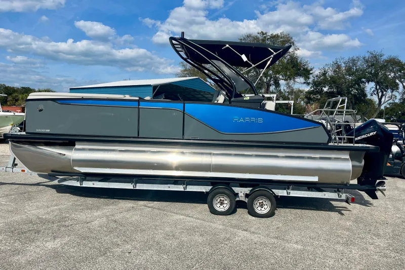 The Image of 2026 Harris Sunliner 230 Sport pontoon boat on trailer. - 1