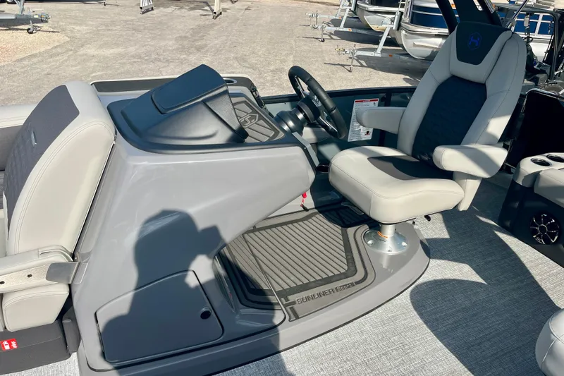 Slide: The Image of Interior of 2026 Harris Sunliner 230 Sport with helm console and seat. - 13