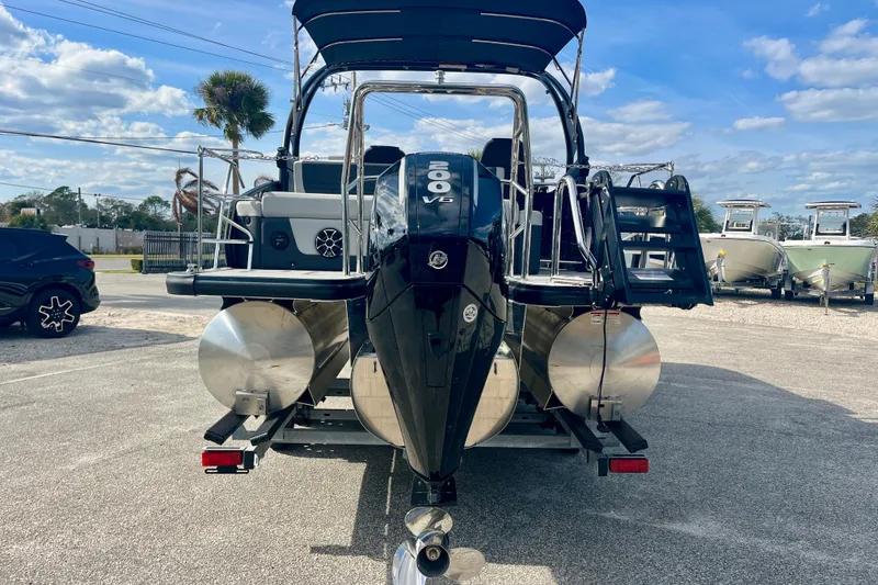 Slide: The Image of 2026 Harris Sunliner 230 Sport with powerful outboard motor. - 3