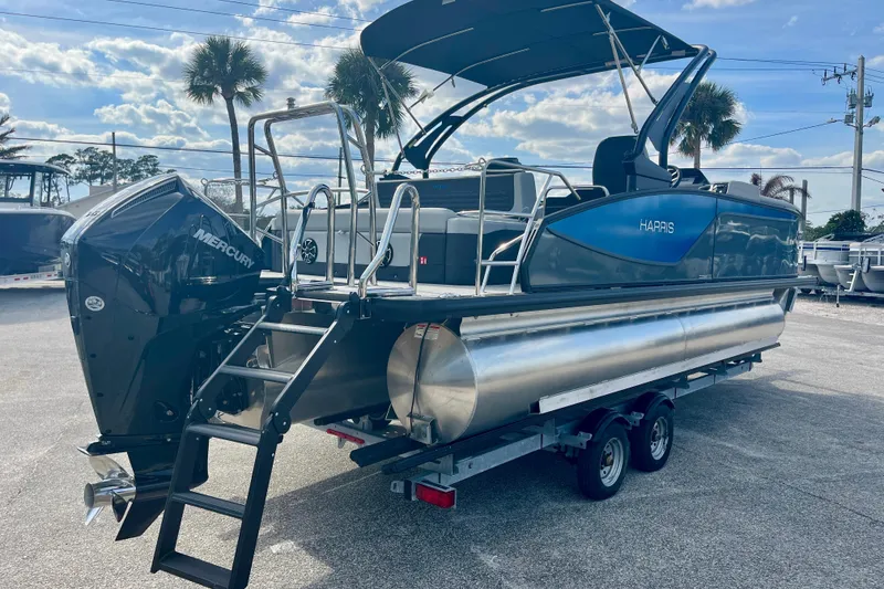 Slide: The Image of Harris Sunliner 230 Sport 2026 on trailer, featuring Mercury engine. - 4