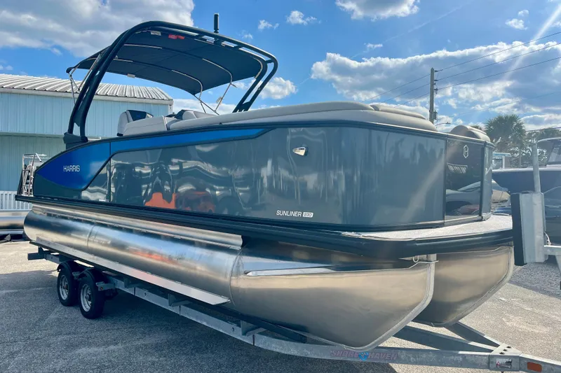 Slide: The Image of 2026 Harris Sunliner 230 Sport pontoon boat on trailer. - 6