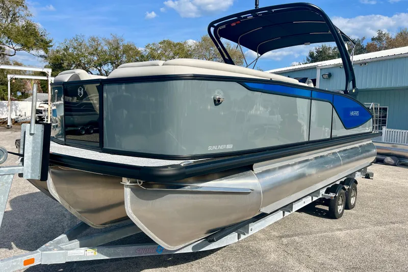 Slide: The Image of 2026 Harris Sunliner 230 Sport pontoon boat on trailer. - 8