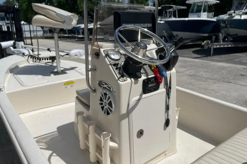 Slide: The Image of 2015 Carolina Skiff JV15CC boat interior with steering console and seating. - 14