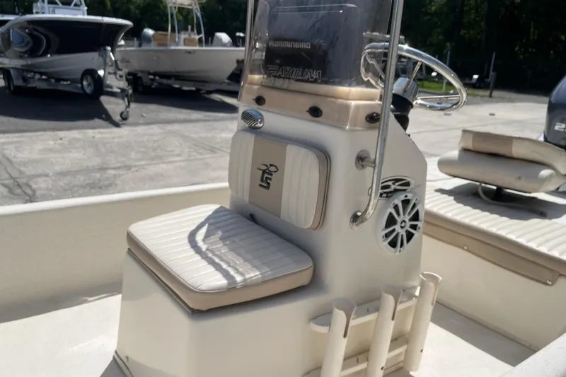 Slide: The Image of 2015 Carolina Skiff JV15CC boat interior with steering console and seating. - 16
