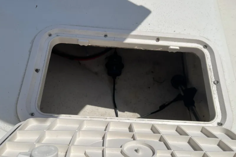 Slide: The Image of Open storage compartment on a 2015 Carolina Skiff JV15CC boat. - 21