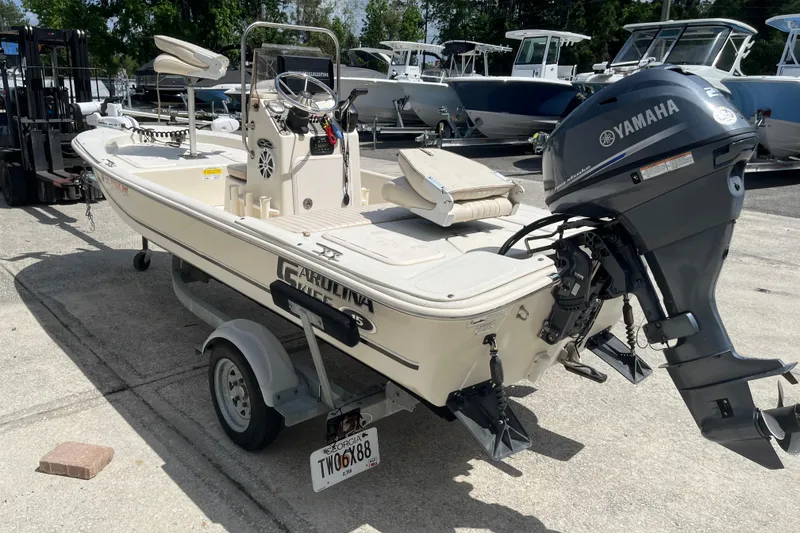 Slide: The Image of 2015 Carolina Skiff JV15CC boat with Yamaha outboard motor on trailer. - 3
