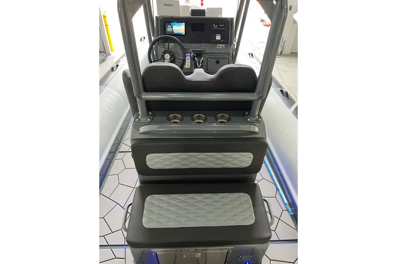 Slide: The Image of Interior view of 2026 Highfield Sport 760 boat, featuring modern dashboard and seating. - 11