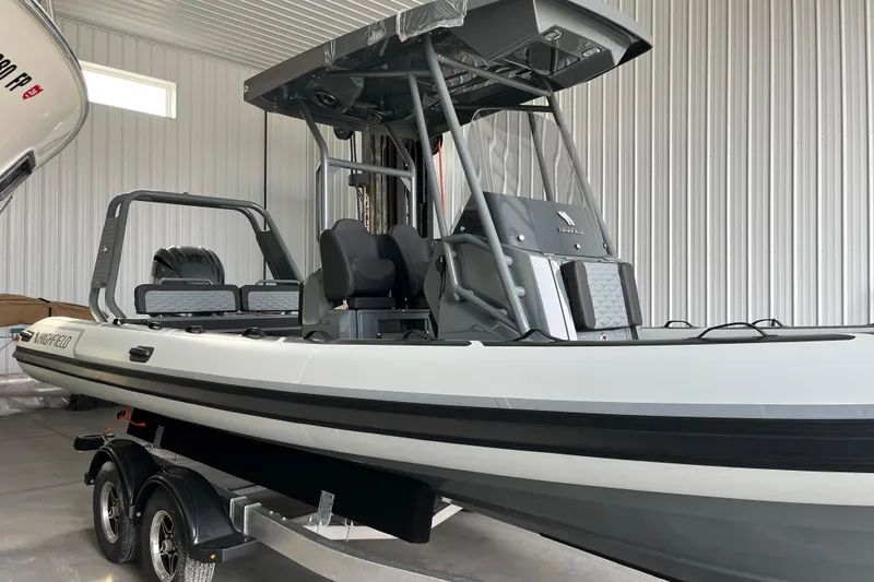 Slide: The Image of 2026 Highfield Sport 760 boat in a garage, showcasing sleek design and modern features. - 2