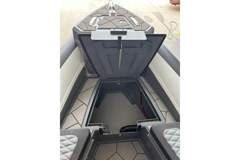 Slide: The Image of Open storage compartment on 2026 Highfield Sport 760 boat, showcasing interior design. - 5