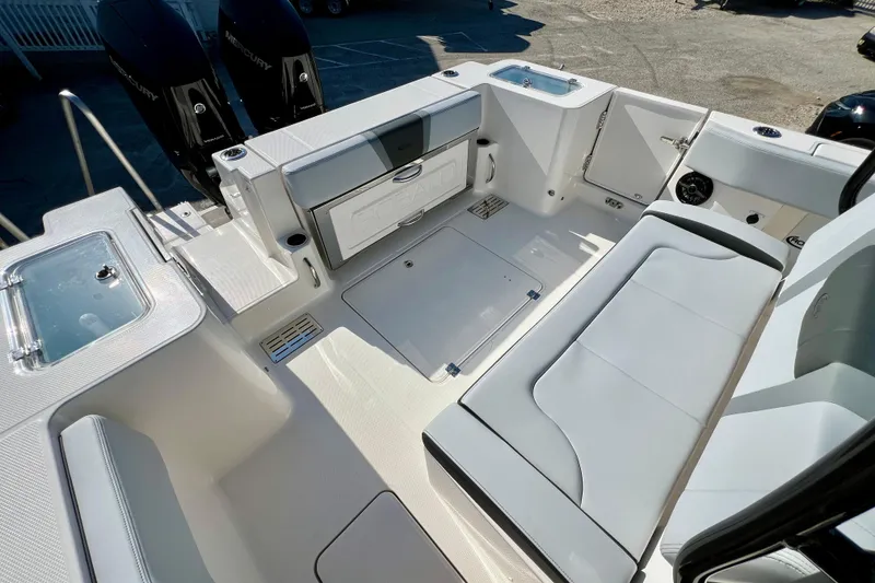 Slide: The Image of 2026 Robalo R300 Center Console boat interior with seating and storage compartments. - 11