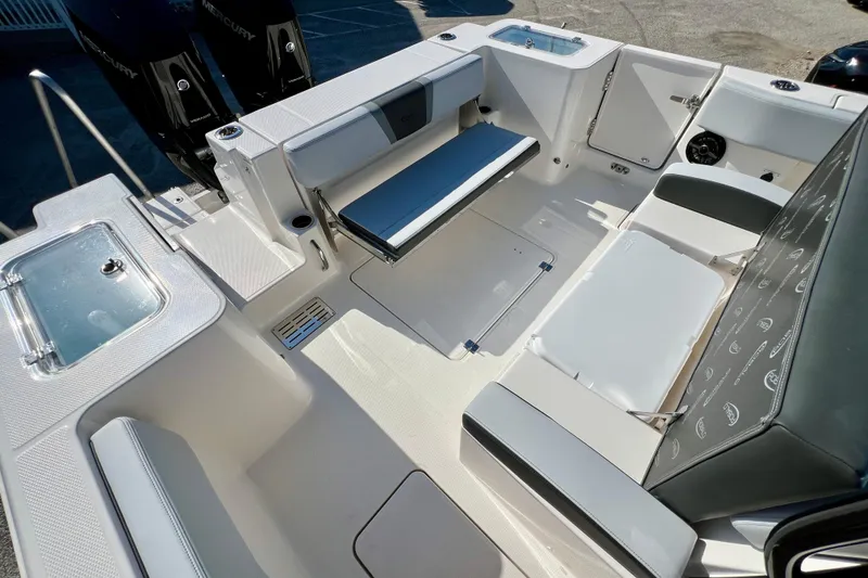 Slide: The Image of 2026 Robalo R300 Center Console boat interior with seating and storage compartments. - 12