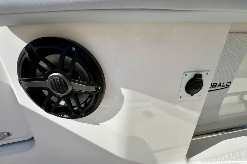 Slide: The Image of 2026 Robalo R300 Center Console boat speaker and power outlet detail. - 21
