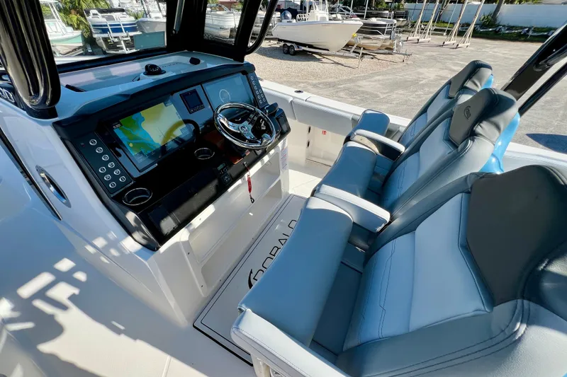 Slide: The Image of 2026 Robalo R300 Center Console boat interior with advanced navigation system and comfortable seating. - 23