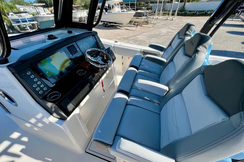 Slide: The Image of 2026 Robalo R300 Center Console boat interior with modern dashboard and seating. - 24
