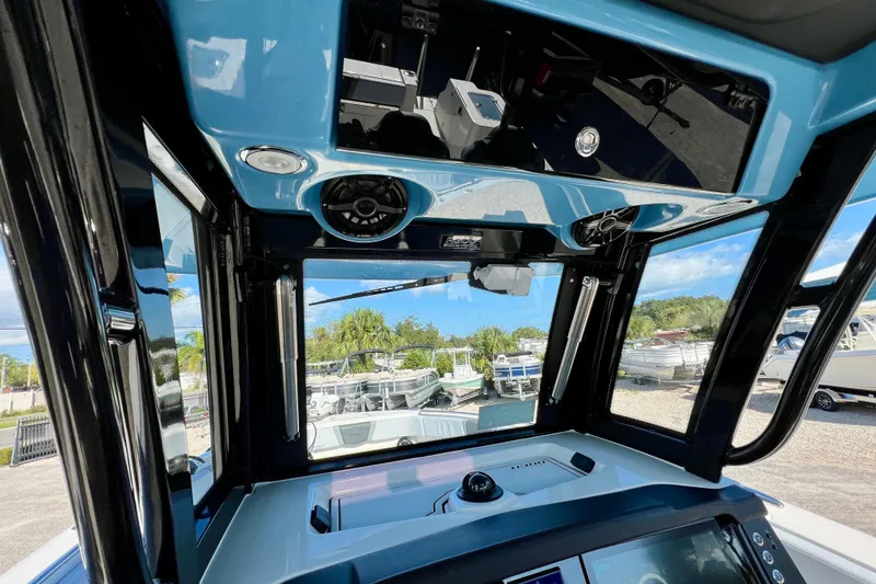 Slide: The Image of Interior view of 2026 Robalo R300 Center Console boat with modern dashboard. - 29