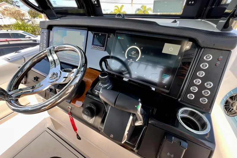 Slide: The Image of 2026 Robalo R300 Center Console dashboard with modern controls and touchscreen display. - 32