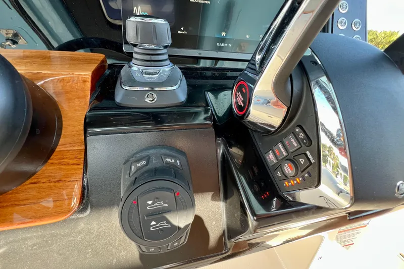 Slide: The Image of 2026 Robalo R300 Center Console boat on trailer under blue sky. - 33