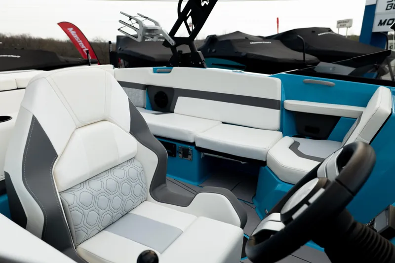 Slide: The Image of Interior of 2023 Heyday H22 boat with modern seating and steering wheel. - 11