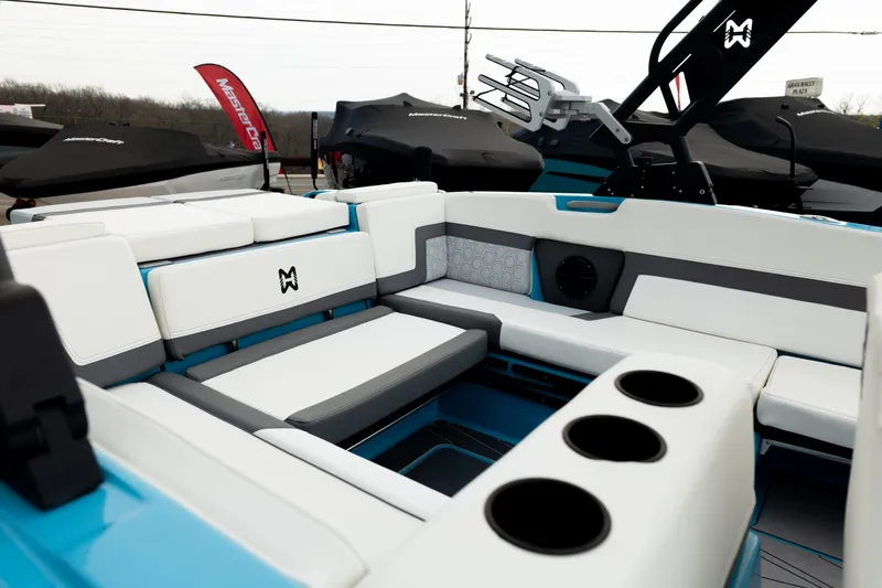 Slide: The Image of 2023 Heyday H22 boat interior with white and gray seating, cup holders, and modern design. - 12