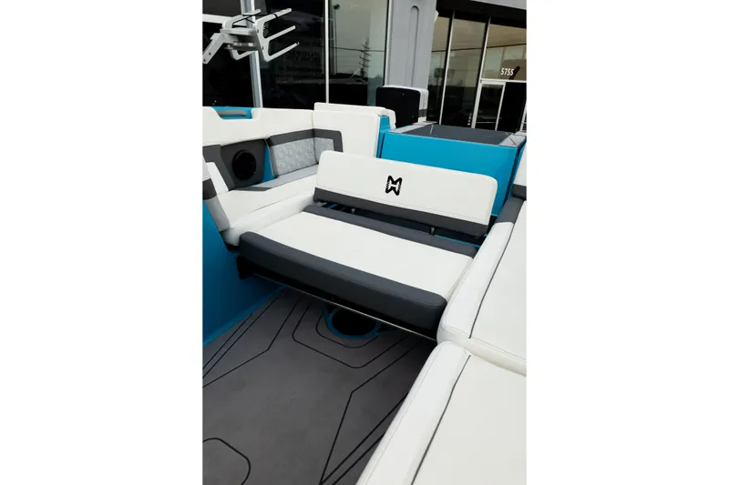 Slide: The Image of 2023 Heyday H22 boat interior with white and blue seating, modern design. - 26