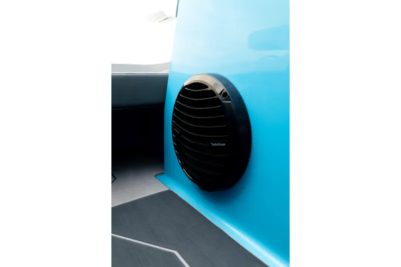Slide: The Image of Black speaker on blue interior of 2023 Heyday H22 boat. - 29