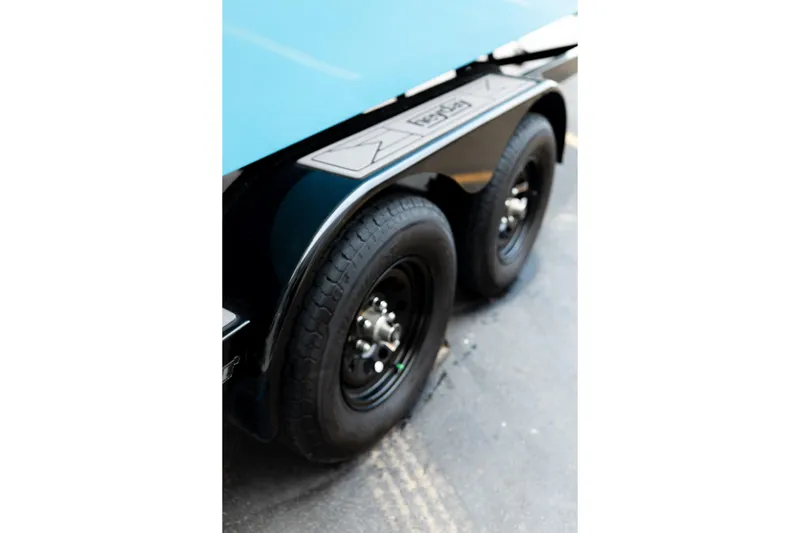 Slide: The Image of 2023 Heyday H22 trailer with dual black wheels on pavement. - 35