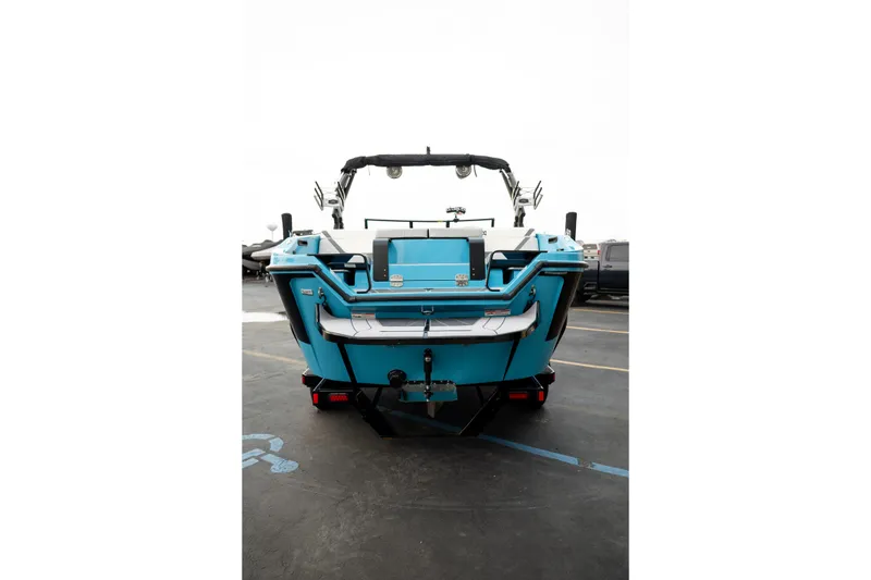 Slide: The Image of 2023 Heyday H22 boat, rear view, showcasing sleek design and vibrant blue color. - 6