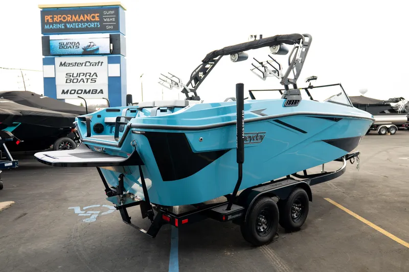Slide: The Image of 2023 Heyday H22 boat in vibrant blue at a marine dealership. - 7