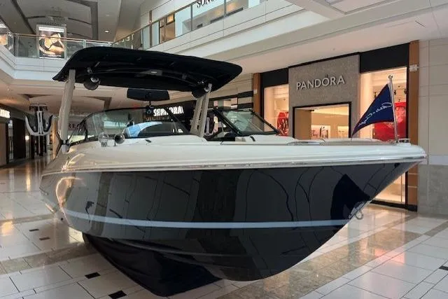 The Image of 2026 Chris-Craft Sportster 25 boat displayed indoors near Pandora store. - 0