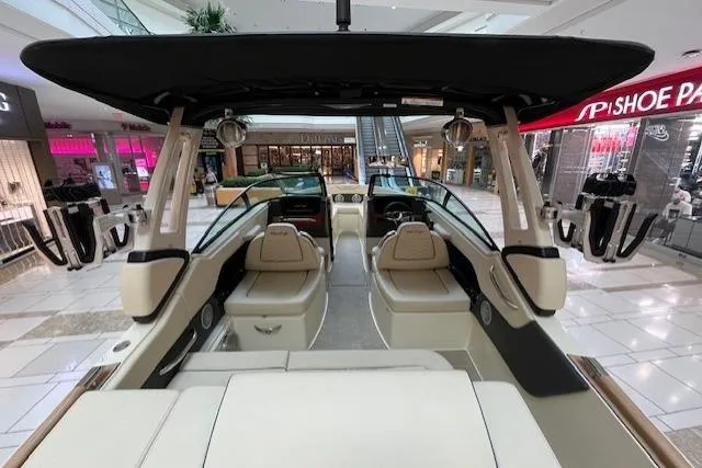 Slide: The Image of 2026 Chris-Craft Sportster 25 boat displayed in a shopping mall, showcasing luxurious interior design. - 11