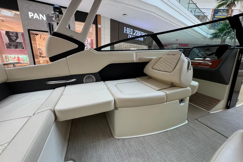 Slide: The Image of Luxurious interior of 2026 Chris-Craft Sportster 25 boat displayed in a shopping mall. - 16