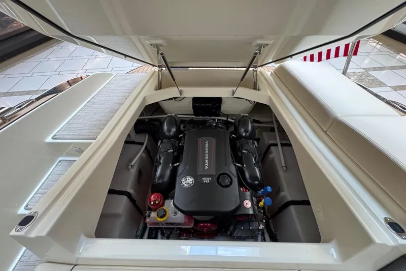 Slide: The Image of Engine compartment of 2026 Chris-Craft Sportster 25, showcasing Volvo Penta engine. - 21